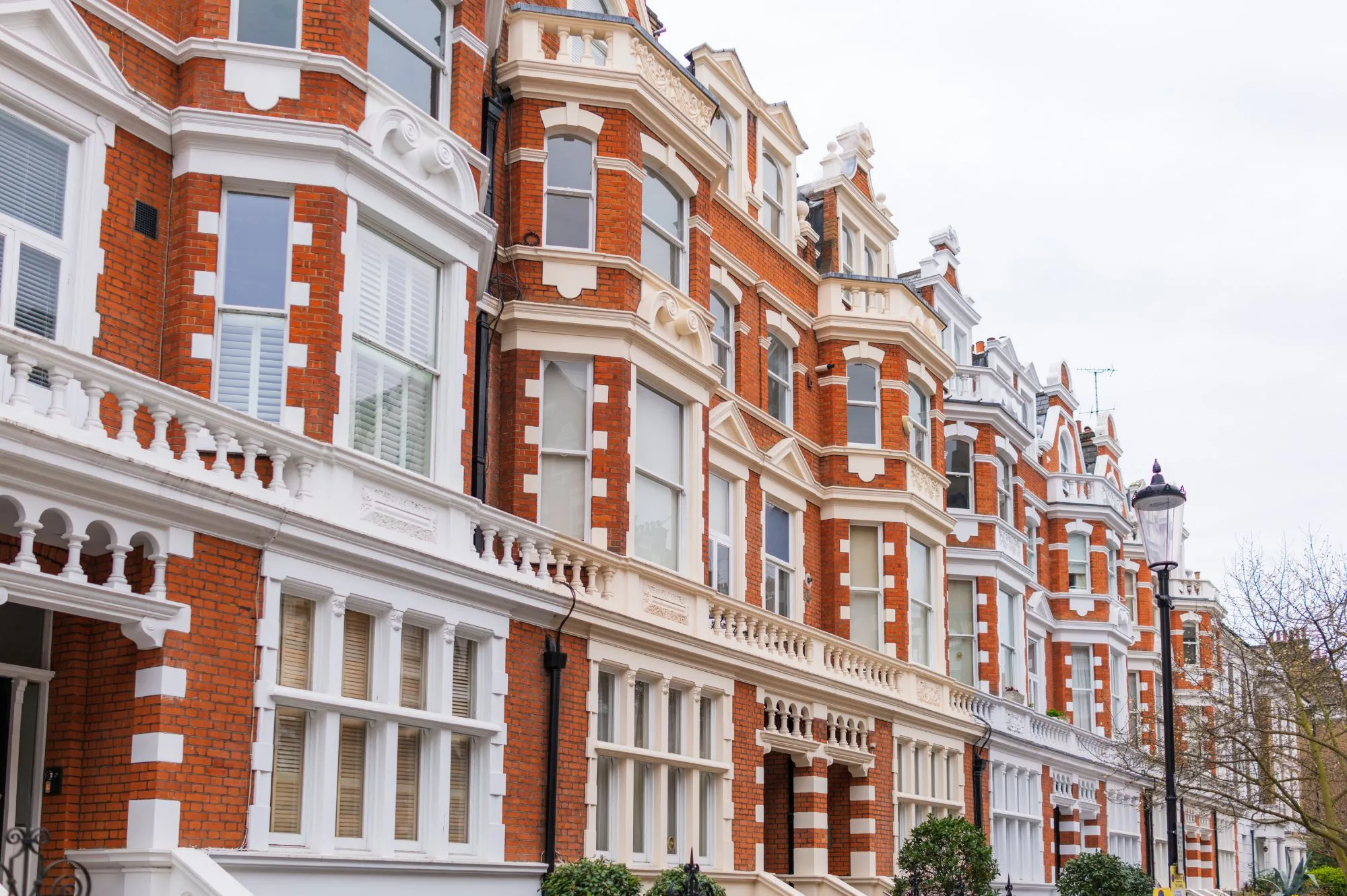 Grand Kensington townhouse with classic white stucco facade